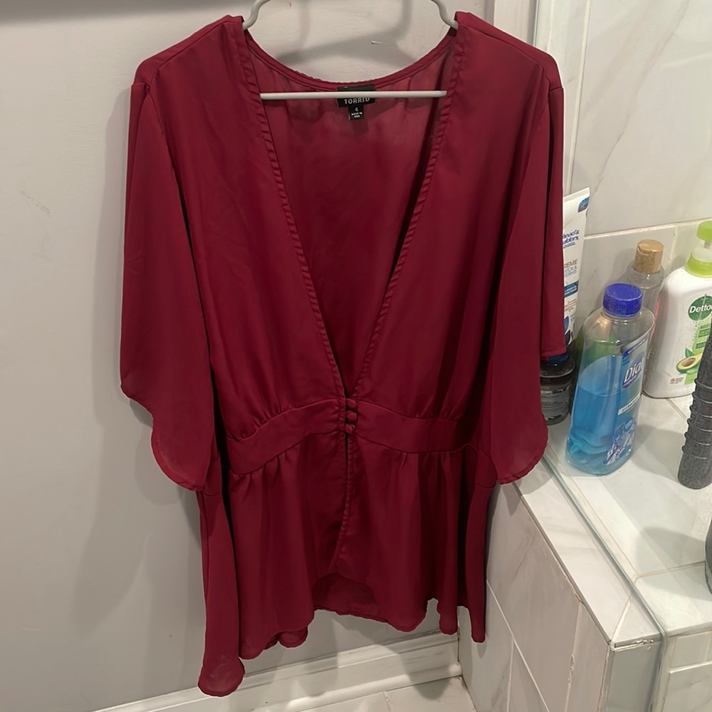 Torrid low cut peplum top